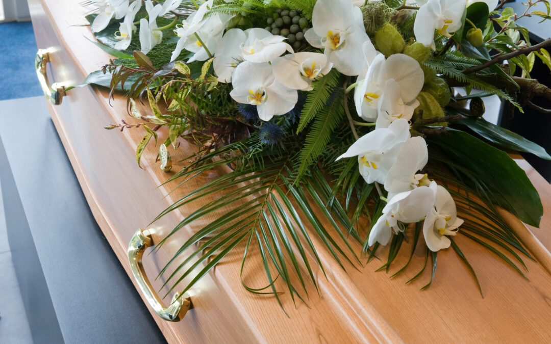 funeral casket and flowers featured image for PIMS Women's History blog post